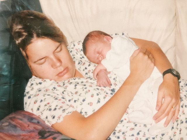 Jill Lewis asleep with newborn baby